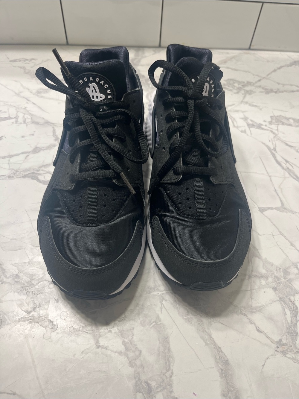 Nike Black Athletic Sneakers with White Midsole Accents